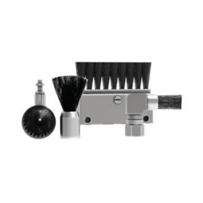 The image features a collection of cleaning tool attachments. There are several brushes, including a wide brush with long black bristles, a smaller round brush with a bristled head, and a cleaning head with a cylindrical attachment. The tools are predomin