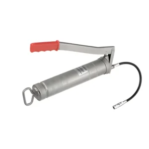 An image of a metal grease gun with a red handle. The gun has a cylindrical body and features a lever arm for dispensing grease. There is a hose attached to the front with a nozzle. The overall color of the gun is silver, and it