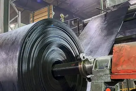 Interior of a factory for manufacturing rubber conveyor belts.
