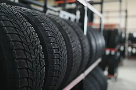 New car tire is placed on the tire storage rack in the tire factory.
